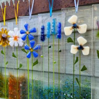 A selection of tall floral glass hangers. 