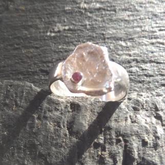 sterling silver band ring with rhodolite set in free form sterling silver